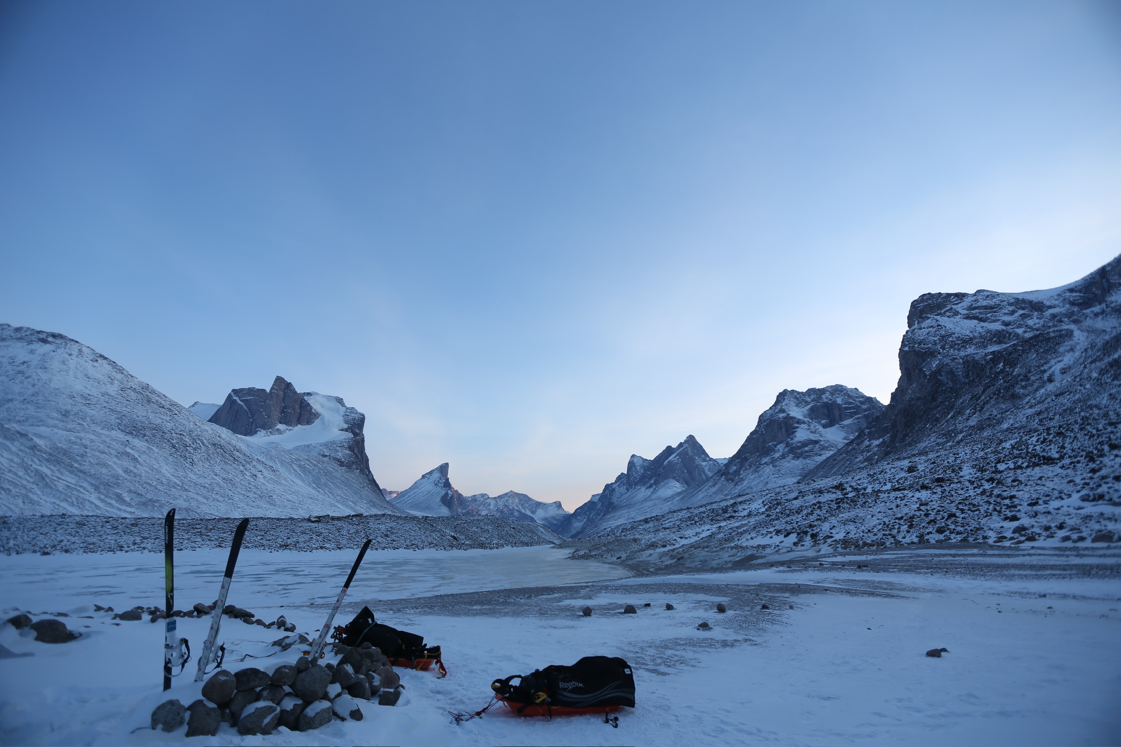 Camp below the peaks of Auyuittuq National Park on Baffin Island at dawn