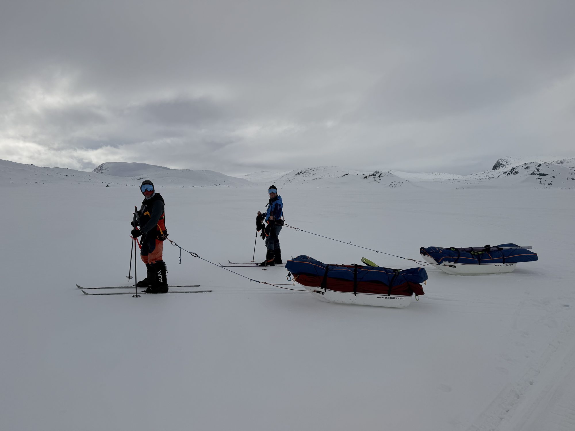 Ben Weber and Erica Stanford with their loaded pulks on the Hardangervidda plateau during their training expedition — training for the Polar Dogs Antarctica Expedition